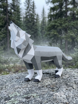 Geometric wolf sculpture on a rock with a forest background